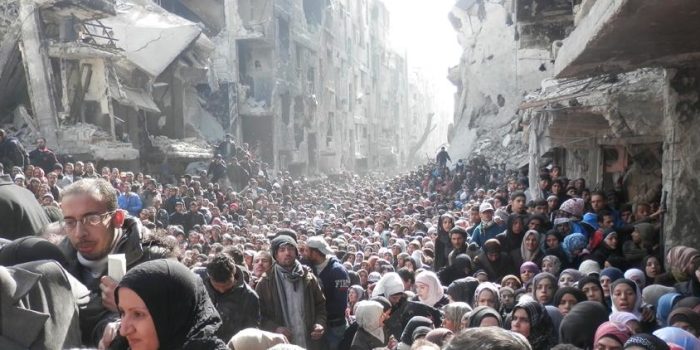 This 2014 image of Palestinians queueing for food pushed Yarmouk to the centre of global attention- Credits_ UNRWA